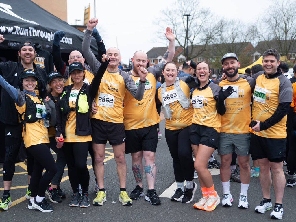 A group of runners in Compton tops cheer