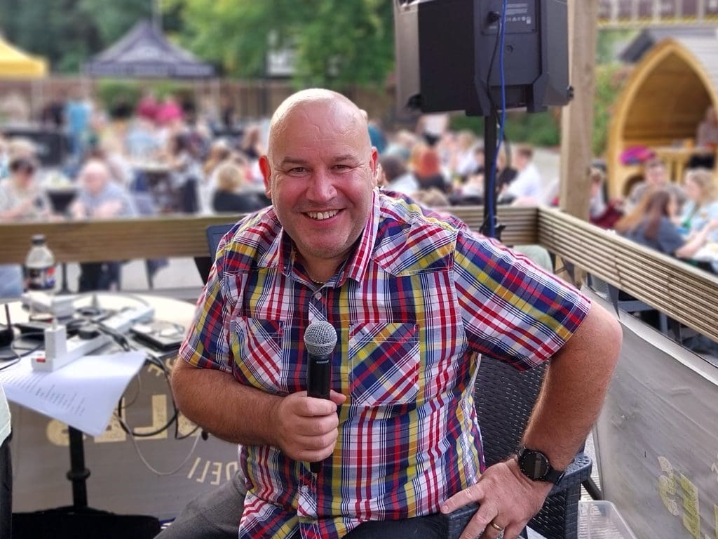 Quiz master Dicky Dodd smiles at the camera