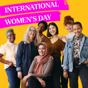 A group of diverse, happy women smile at the camera