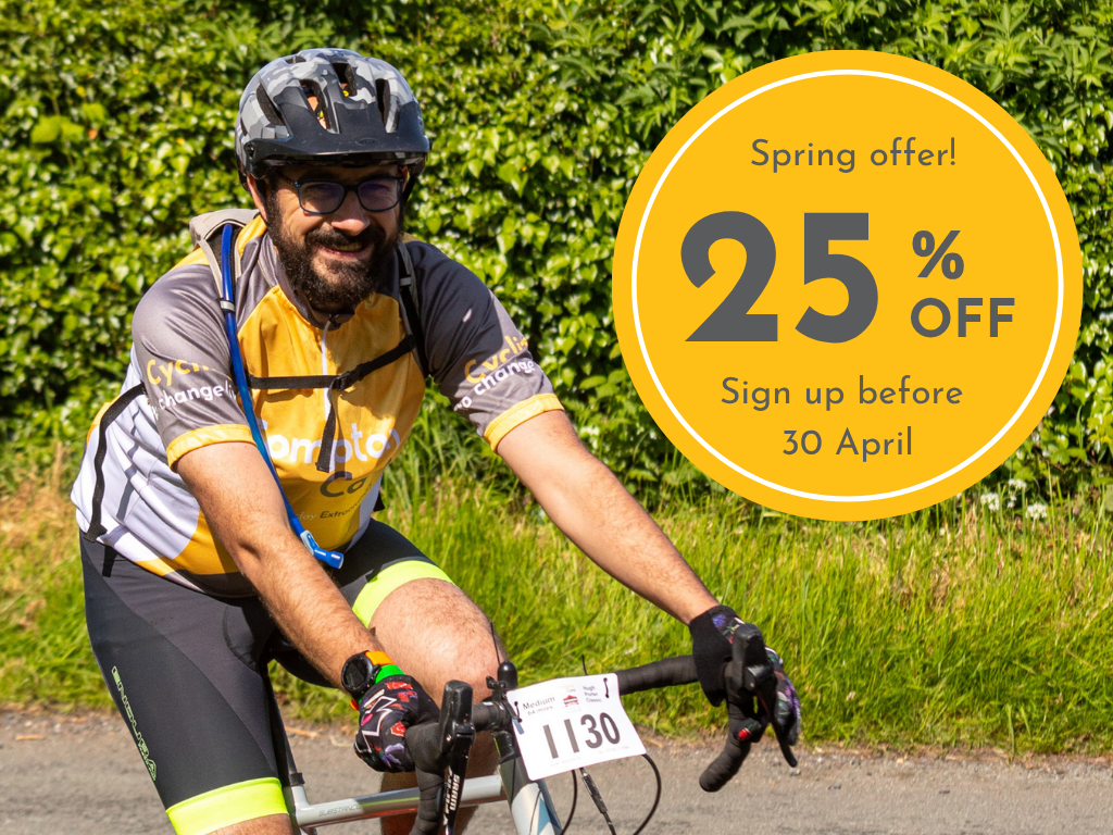A cyclist in a Compton top smiles at the camera, a sticker advertises 25% discount.
