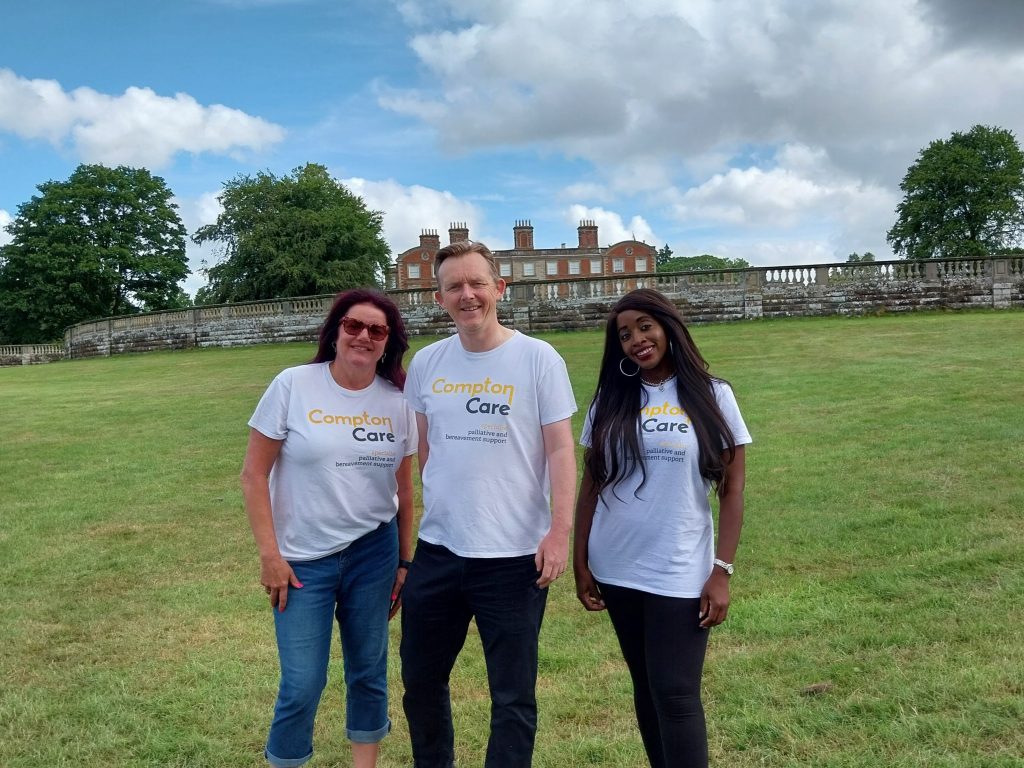 Three Compton colleagues stand in front of Weston Park